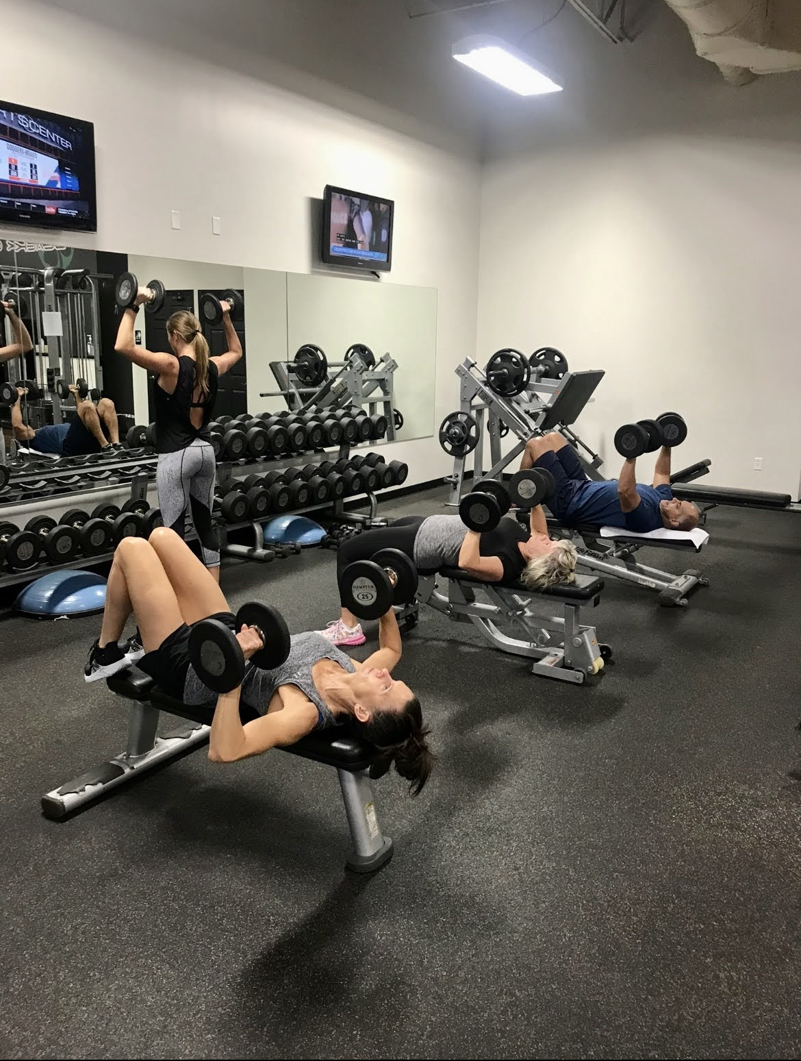 Adults doing strength training together at Black Clover Fitness in West Omaha