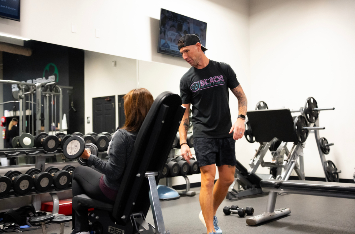 Personal trainer working with a client at Black Clover Fitness in West Omaha